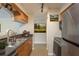 Well-lit kitchen with stainless steel appliances and a breakfast bar at 12293 Sailwinds Dr # 206, Largo, FL 33773