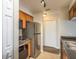 Compact kitchen featuring stainless steel appliances and a pantry at 12293 Sailwinds Dr # 206, Largo, FL 33773