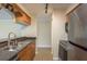 Bright kitchen showcasing stainless steel appliances, stone countertops and wood cabinetry at 12293 Sailwinds Dr # 206, Largo, FL 33773
