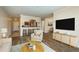 Bright living room featuring an open layout with a kitchen bar and modern furniture at 12293 Sailwinds Dr # 206, Largo, FL 33773