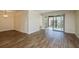 Spacious living room with sliding glass doors leading to a balcony at 12293 Sailwinds Dr # 206, Largo, FL 33773