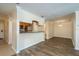 Open-concept living space with a kitchen bar and neutral walls at 12293 Sailwinds Dr # 206, Largo, FL 33773