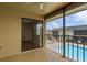 Screened porch overlooking pool with sliding glass door at 12293 Sailwinds Dr # 206, Largo, FL 33773