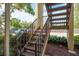 Stairway view with landscaping alongside, leading to upper level condos at 12293 Sailwinds Dr # 206, Largo, FL 33773