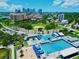 City of St. Petersburg aerial view of community pool, baseball field, and lush green spaces with a city skyline backdrop at 130 4Th N Ave # 608, St Petersburg, FL 33701