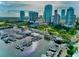Waterfront aerial view of a marina with sailboats and cityscape, with plenty of greenery in sight at 130 4Th N Ave # 608, St Petersburg, FL 33701