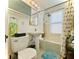 Bright bathroom with pedestal sink, subway tile surround, and shower-tub combo at 130 4Th N Ave # 608, St Petersburg, FL 33701