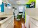 Eat in kitchen featuring white cabinets, granite countertop, and hardwood floors at 130 4Th N Ave # 608, St Petersburg, FL 33701