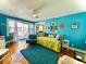 Bright living room featuring hard wood floors, daybed, and balcony access at 130 4Th N Ave # 608, St Petersburg, FL 33701