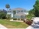 Aerial view of a home with a well-manicured lawn, mature trees, and elegant landscaping at 13310 Waterford Run Dr, Riverview, FL 33569