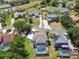 Aerial view of a neighborhood featuring homes with swimming pools and lush landscaping at 13310 Waterford Run Dr, Riverview, FL 33569