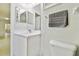 Bathroom showcases a white vanity, ample lighting, and neutral walls at 13310 Waterford Run Dr, Riverview, FL 33569