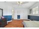 Bedroom showcasing hardwood floors, double closets, and soft lighting at 13310 Waterford Run Dr, Riverview, FL 33569