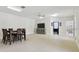 Bonus room with tile flooring, dining table, ceiling fan, TV and access to an ensuite bathroom at 13310 Waterford Run Dr, Riverview, FL 33569