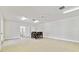 Bonus room featuring tile flooring, ceiling fan, dining table and access to multiple rooms at 13310 Waterford Run Dr, Riverview, FL 33569