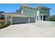Stylish two-story home with a three-car garage and a spacious driveway at 13310 Waterford Run Dr, Riverview, FL 33569