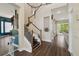 Home entryway showcasing the staircase and hardwood flooring at 13310 Waterford Run Dr, Riverview, FL 33569