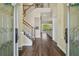 Home entryway showcasing the staircase and hardwood flooring at 13310 Waterford Run Dr, Riverview, FL 33569