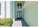 Exterior view of the home's front door with decorative wreaths at 13310 Waterford Run Dr, Riverview, FL 33569