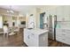 Kitchen featuring white cabinets, an island with stone countertops and stainless appliances at 13310 Waterford Run Dr, Riverview, FL 33569