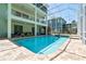 Inviting screened-in pool with an attached spa, perfect for relaxation and entertainment at 13310 Waterford Run Dr, Riverview, FL 33569