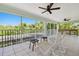Large screened porch area features tile floors, ceiling fans, seating, and a view of the trees at 13310 Waterford Run Dr, Riverview, FL 33569