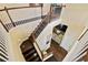 Spacious staircase with wood steps and white railings, overlooking the living area at 13310 Waterford Run Dr, Riverview, FL 33569