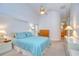 Serene bedroom with soft lighting, vaulted ceilings, and ample closet space at 14119 Stonegate Dr, Tampa, FL 33624