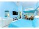 Primary bedroom featuring a large window and blue walls at 14119 Stonegate Dr, Tampa, FL 33624