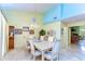 Spacious dining area with marble floors, a chandelier, and access to the kitchen, perfect for entertaining at 14119 Stonegate Dr, Tampa, FL 33624