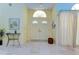 Bright foyer with marble floors, double doors, an arched window, and elegant decorative accents at 14119 Stonegate Dr, Tampa, FL 33624