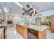 Open kitchen design features ample counter space, light fixtures, and seamless access to dining at 14119 Stonegate Dr, Tampa, FL 33624