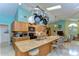 Gourmet kitchen featuring island, granite countertops, custom cabinets, and modern appliances at 14119 Stonegate Dr, Tampa, FL 33624