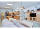 Open living room, blending kitchen, dining, and living spaces with natural light and modern aesthetics at 14119 Stonegate Dr, Tampa, FL 33624