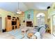A comfortable living room featuring a fireplace, built-in shelving, and tile floors at 14119 Stonegate Dr, Tampa, FL 33624