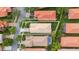 Aerial view of a tan single-story home with a neatly manicured lawn and a paved driveway in Tampa, Florida at 14521 Mirasol Manor Ct, Tampa, FL 33626