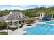 A beautiful clubhouse with an in-ground swimming pool and kiddie pool with slide, perfect for summertime enjoyment at 14521 Mirasol Manor Ct, Tampa, FL 33626