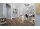 Open concept dining room with hardwood floors, modern lighting, and neutral paint at 14521 Mirasol Manor Ct, Tampa, FL 33626