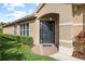 Attractive front entryway with a dark-colored door and manicured landscaping at 14521 Mirasol Manor Ct, Tampa, FL 33626