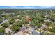 Residential area with lush greenery featuring a home with an in-ground pool at 150 23Rd N Ave, St Petersburg, FL 33704