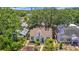 Charming home surrounded by trees, with views of the city skyline in the distance at 150 23Rd N Ave, St Petersburg, FL 33704