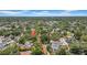 Overview of homes in a tree-lined neighborhood with red brick streets and distant views at 150 23Rd N Ave, St Petersburg, FL 33704