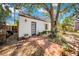 A private backyard offers mature trees, brick walkway, and a shed at 150 23Rd N Ave, St Petersburg, FL 33704
