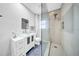 Bright bathroom with a glass vessel sink and walk-in shower with decorative tile at 150 23Rd N Ave, St Petersburg, FL 33704