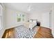 Bright bedroom features hardwood floors, neutral paint, and natural lighting at 150 23Rd N Ave, St Petersburg, FL 33704