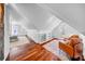 Light-filled bonus room with hardwood floors, built-in shelving, and comfortable seating area at 150 23Rd N Ave, St Petersburg, FL 33704