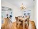 Dining room with hardwood floors, decorative chandelier, and adjoins a sitting room at 150 23Rd N Ave, St Petersburg, FL 33704