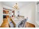 Elegant dining room with stylish chandelier, adjacent to kitchen, great for hosting dinner parties at 150 23Rd N Ave, St Petersburg, FL 33704