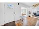 Welcoming foyer with hardwood floors, a white front door, and ample natural light at 150 23Rd N Ave, St Petersburg, FL 33704