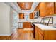 Well-lit kitchen with stainless steel appliances, wood cabinets and a copper colored ceiling at 150 23Rd N Ave, St Petersburg, FL 33704